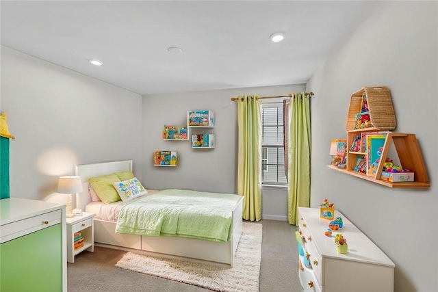 bedroom with recessed lighting and light carpet