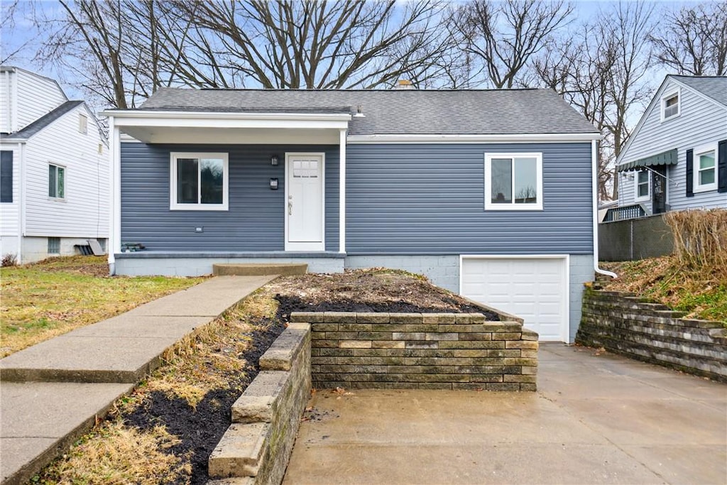 590 Hope St, Scott Twp Sal, PA 15220 - bungalow-style house featuring a garage, concrete driveway, and roof with shingles
