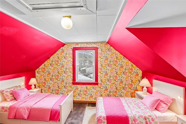 bedroom featuring lofted ceiling, carpet floors, baseboards, and wallpapered walls