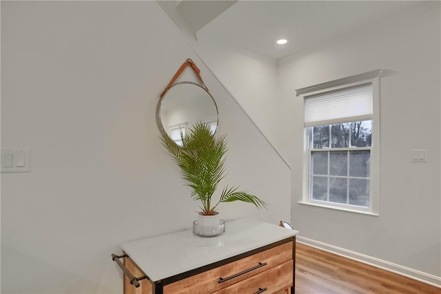 details featuring baseboards, wood finished floors, and recessed lighting