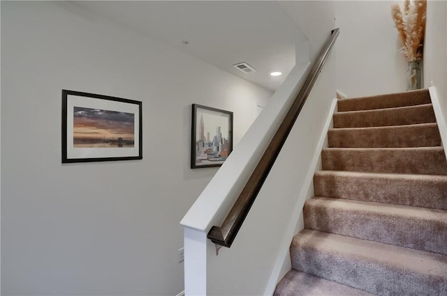 stairs featuring visible vents and recessed lighting