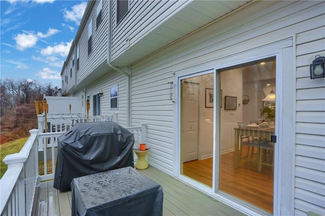 wooden terrace featuring grilling area