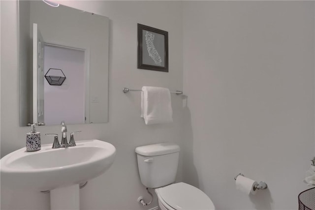 bathroom featuring a sink and toilet