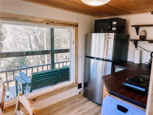 1958 Church Hill Rd, North-Other Area, PA 16351 - kitchen with wooden ceiling, black microwave, a wealth of natural light, and dark cabinets
