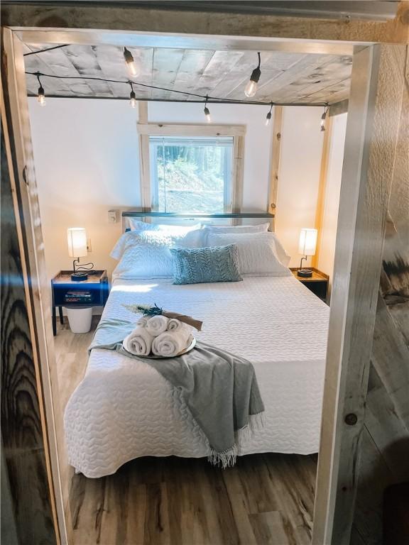 1958 Church Hill Rd, North-Other Area, PA 16351 - bedroom with wood finished floors and track lighting