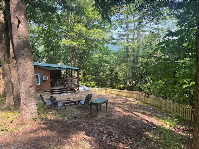 1958 Church Hill Rd, North-Other Area, PA 16351 - view of yard with an outdoor fire pit, fence, and a wooden deck