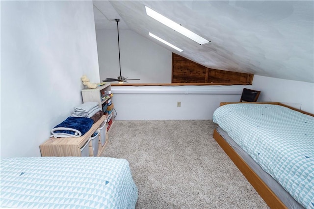 bedroom with light carpet and vaulted ceiling with skylight