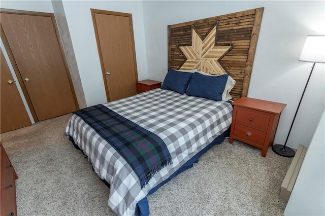 bedroom featuring light colored carpet