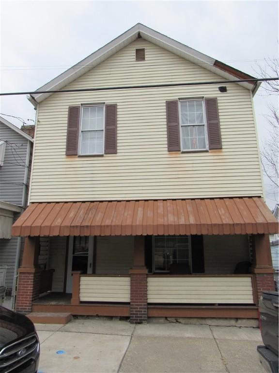 view of front of home featuring covered porch