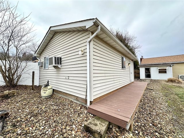 view of property exterior featuring fence