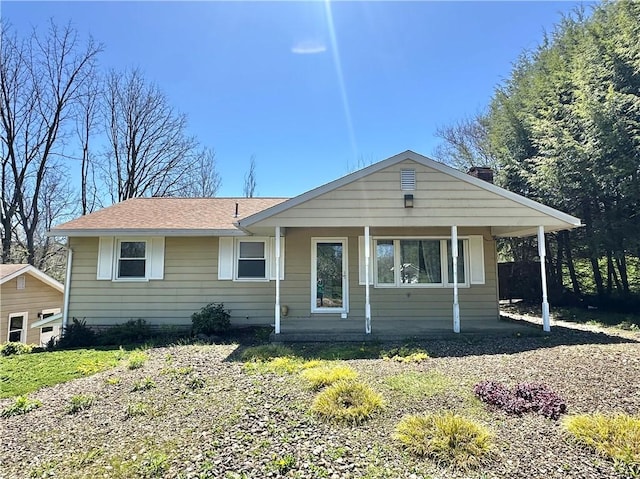 view of front of home with roof with shingles