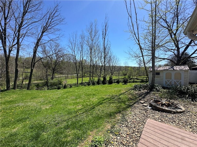view of yard featuring a shed and an outbuilding