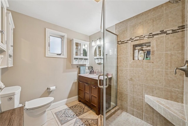 full bathroom with a stall shower, tile patterned flooring, vanity, and toilet