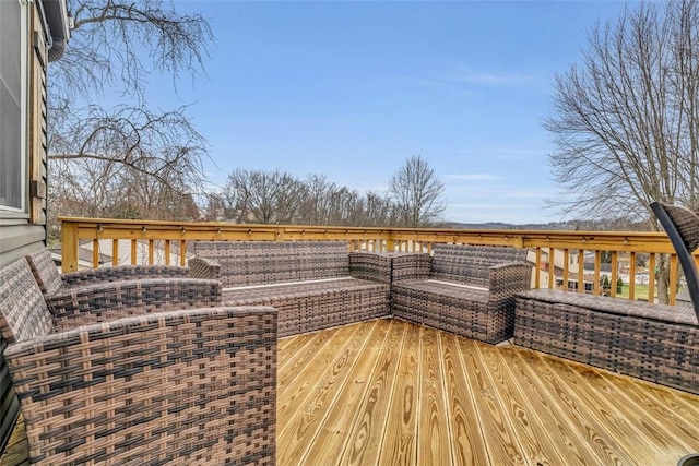 wooden terrace featuring an outdoor hangout area