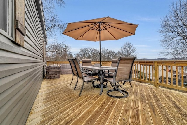 wooden deck with outdoor dining space