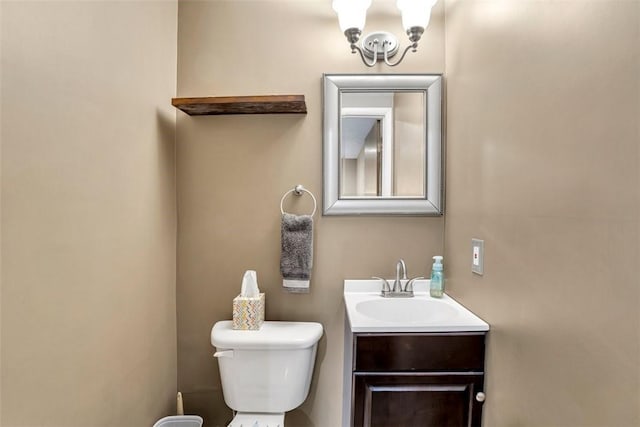 bathroom featuring toilet and vanity