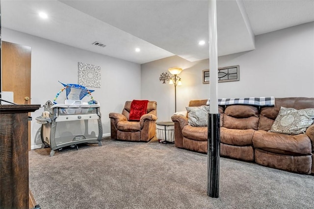 living room featuring baseboards, carpet floors, visible vents, and recessed lighting