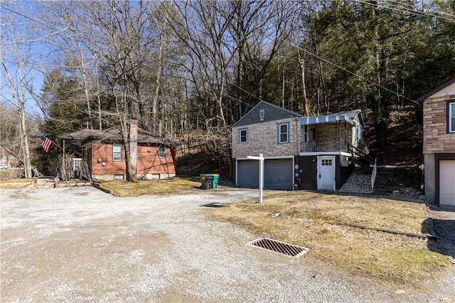 exterior space featuring driveway and an attached garage