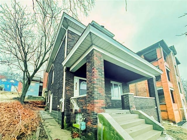 view of front of property featuring brick siding