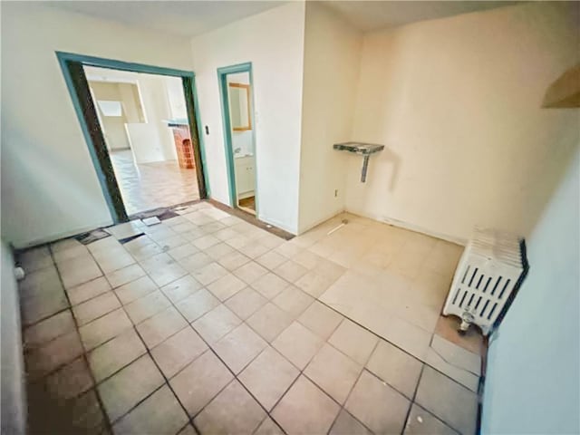 spare room with light tile patterned floors