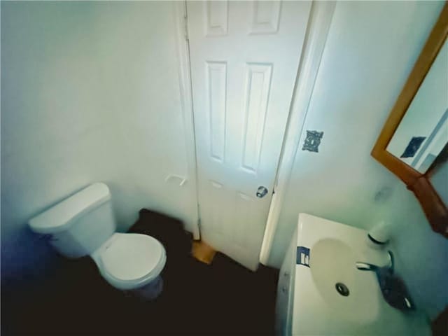 bathroom featuring toilet