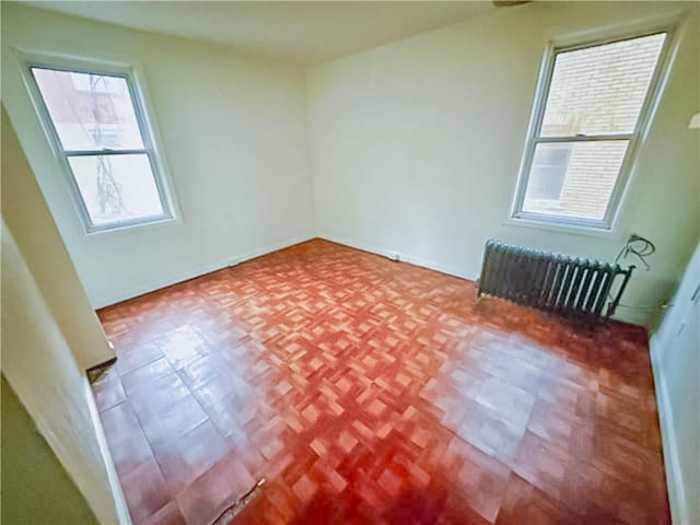 empty room featuring radiator heating unit