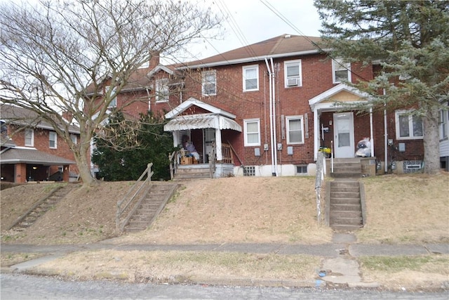 view of front of property featuring brick siding