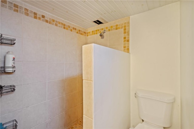 bathroom with walk in shower and toilet