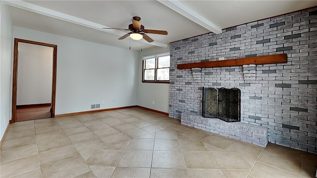 unfurnished living room with visible vents, ceiling fan, tile patterned flooring, a brick fireplace, and beam ceiling