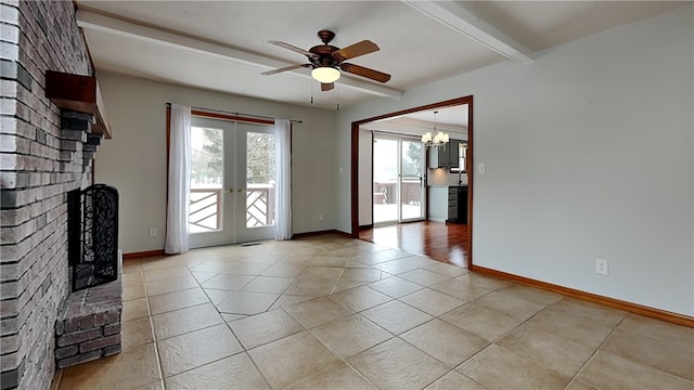 unfurnished living room with baseboards, a ceiling fan, french doors, beam ceiling, and light tile patterned flooring