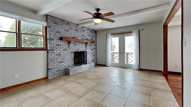 unfurnished living room featuring french doors, beam ceiling, a brick fireplace, light tile patterned flooring, and baseboards