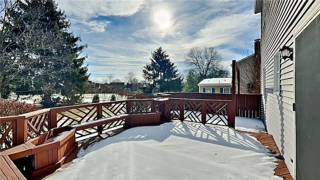 view of snow covered deck