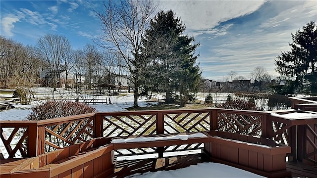 view of snow covered deck