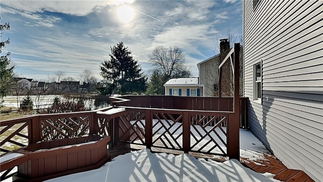 view of snow covered deck