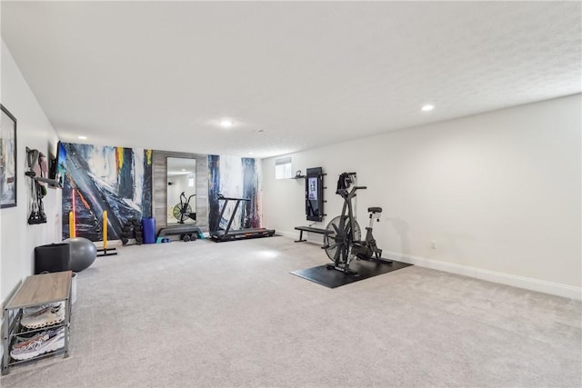 exercise room with carpet, baseboards, and recessed lighting