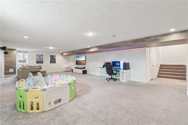 playroom featuring carpet floors, baseboards, a textured ceiling, and recessed lighting