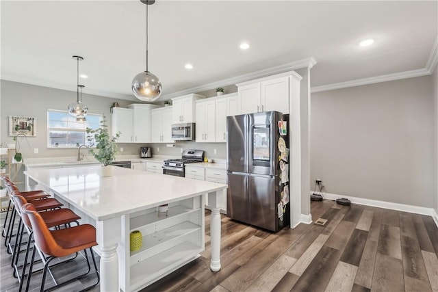 kitchen featuring dark wood finished floors, crown molding, open shelves, light countertops, and appliances with stainless steel finishes