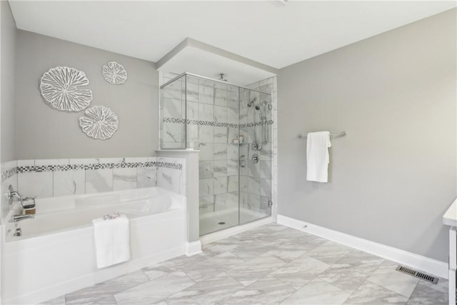 full bath with visible vents, a shower stall, baseboards, and a bath