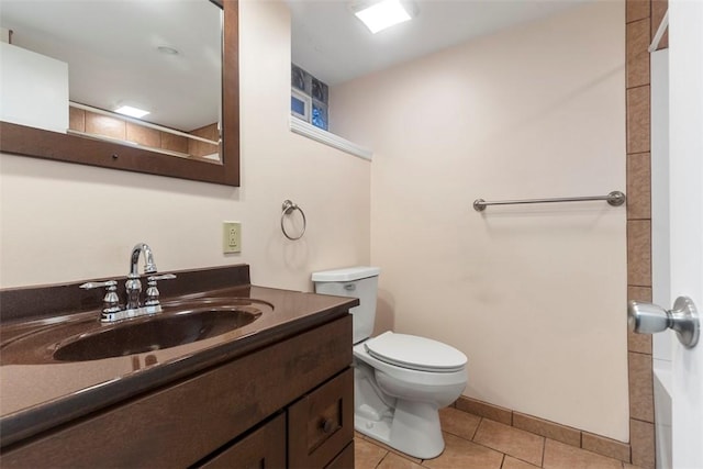 full bathroom with vanity, toilet, and tile patterned floors