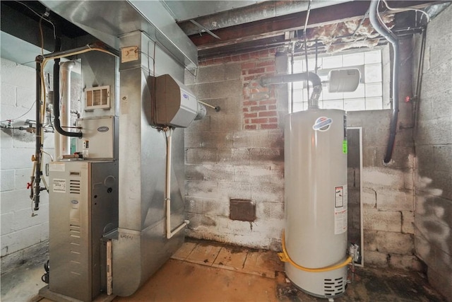 utilities featuring gas water heater, visible vents, and heating unit