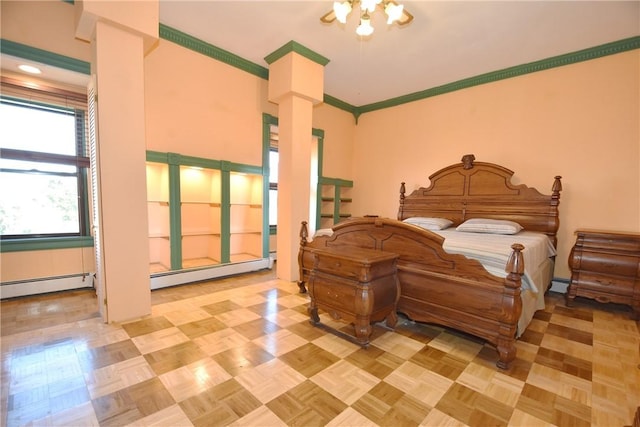 bedroom featuring a baseboard heating unit, ornamental molding, and ornate columns