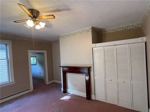 unfurnished living room featuring carpet, a textured ceiling, a baseboard radiator, and baseboards