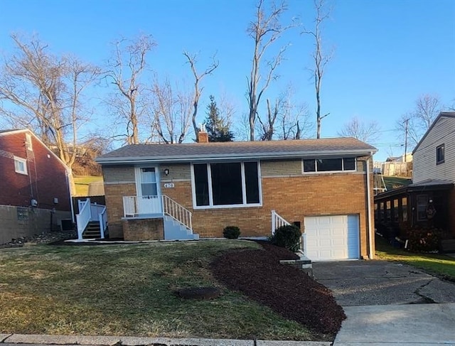 view of front of home featuring a garage, driveway, brick siding, a chimney, and a front yard