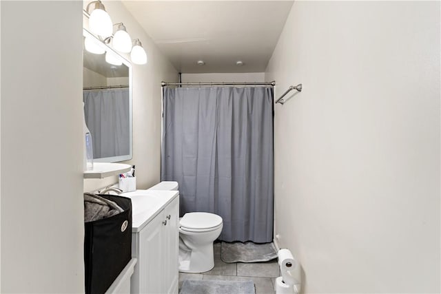 full bath with tile patterned flooring, curtained shower, vanity, and toilet