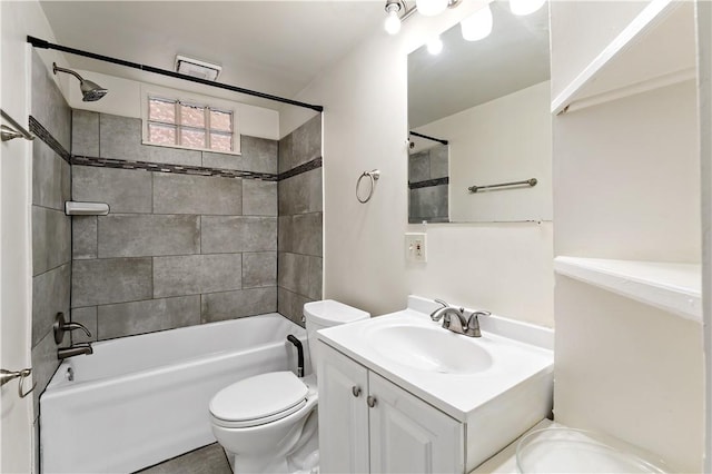 bathroom with vanity, toilet, and shower / bathtub combination