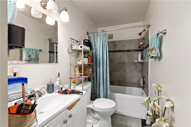 full bathroom featuring toilet, tile patterned flooring, shower / bath combo, and vanity