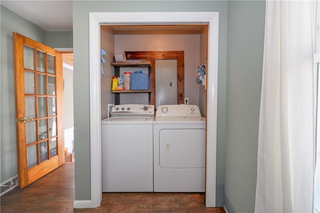 laundry room featuring washer and dryer, laundry area, and dark wood finished floors