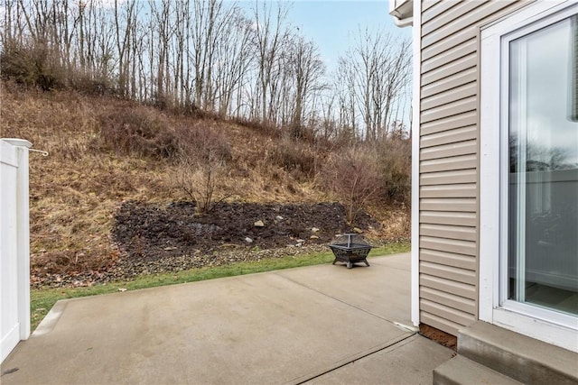 view of patio / terrace featuring an outdoor fire pit