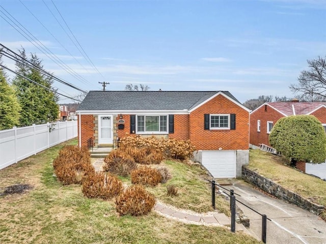 view of front facade featuring brick siding, concrete driveway, an attached garage, fence, and a front yard