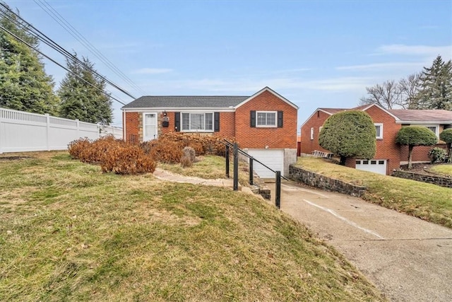 single story home featuring a garage, brick siding, fence, concrete driveway, and a front yard